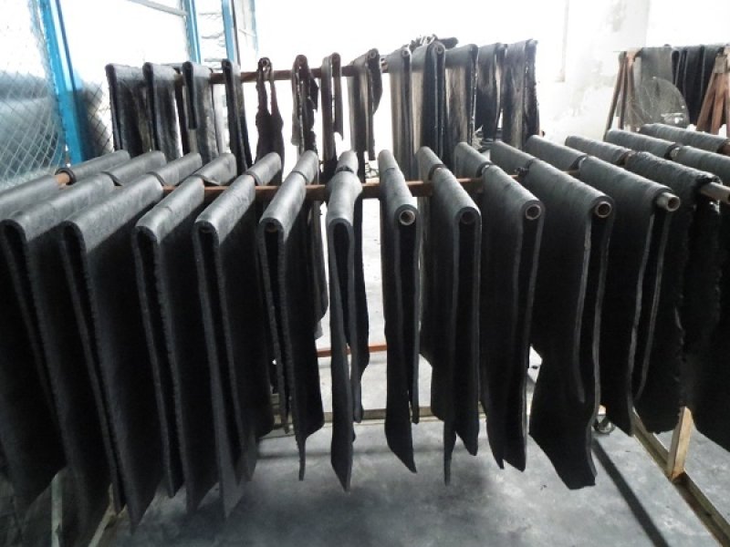Before vulcanization, what is the purpose of cutting the unvulcanized rubber sheet and preformed unvulcanized rubber sheet? 